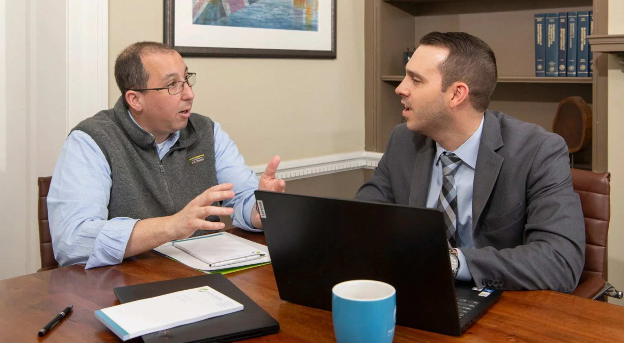 Advisor reviewing health insurance plans with a small business owner in New Jersey