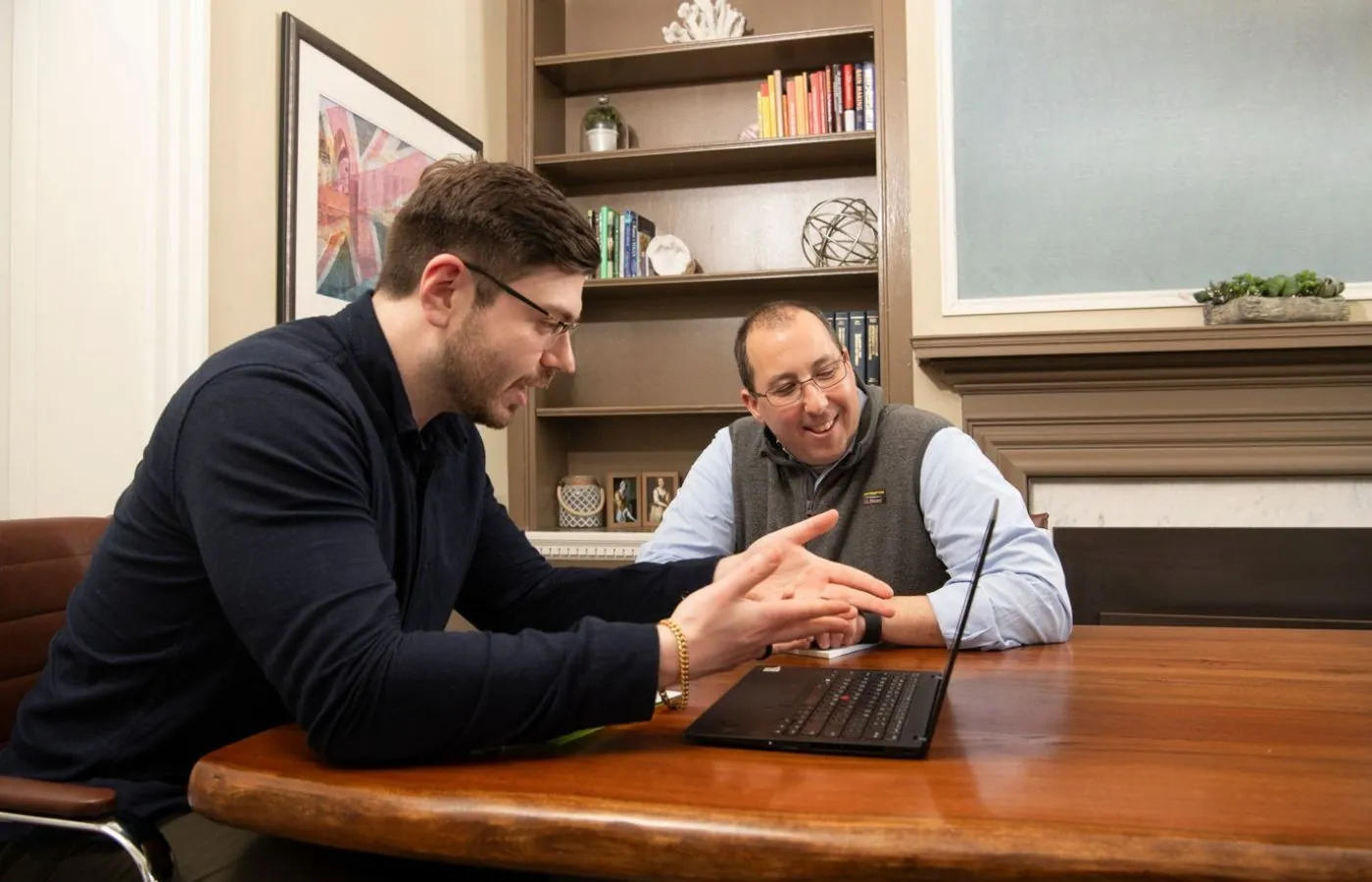 Advisor walking through insurance and benefits plan with a business client