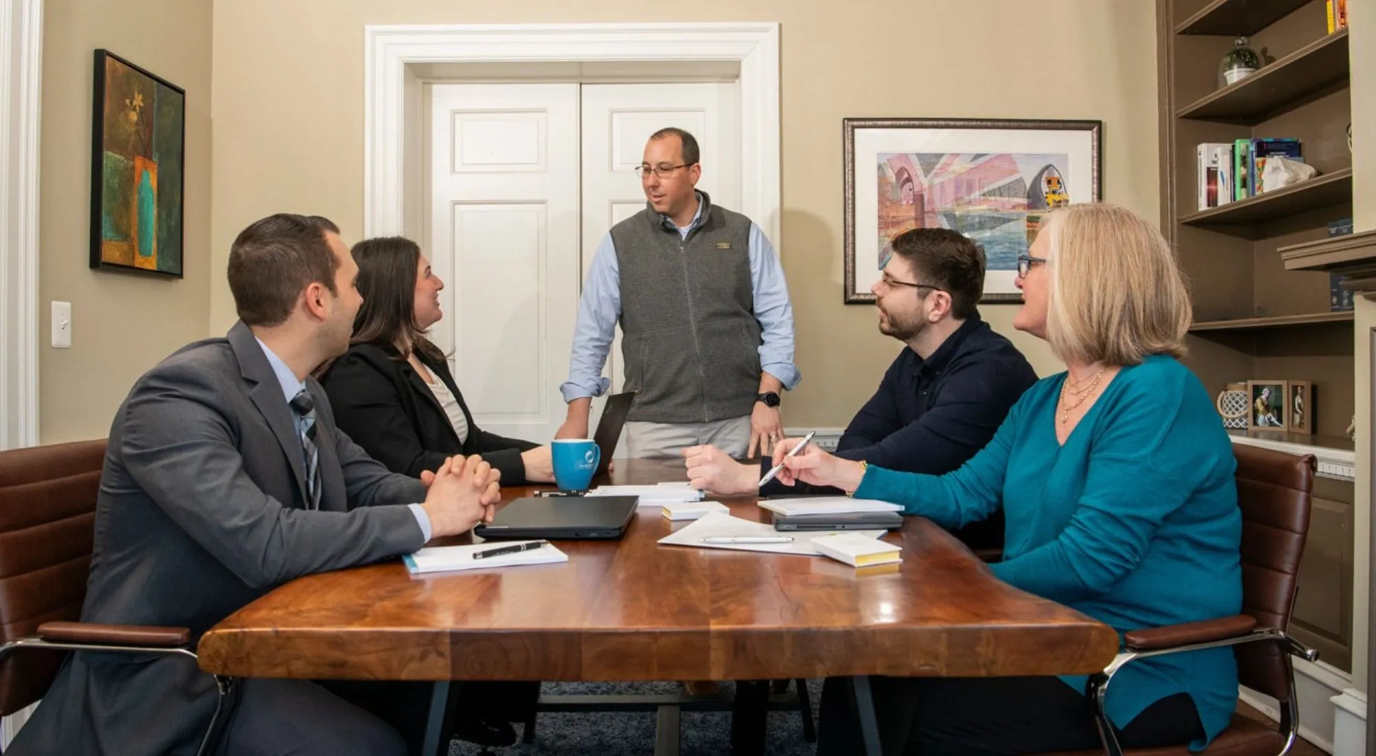 Small business owner meeting with an advisor to review health insurance options